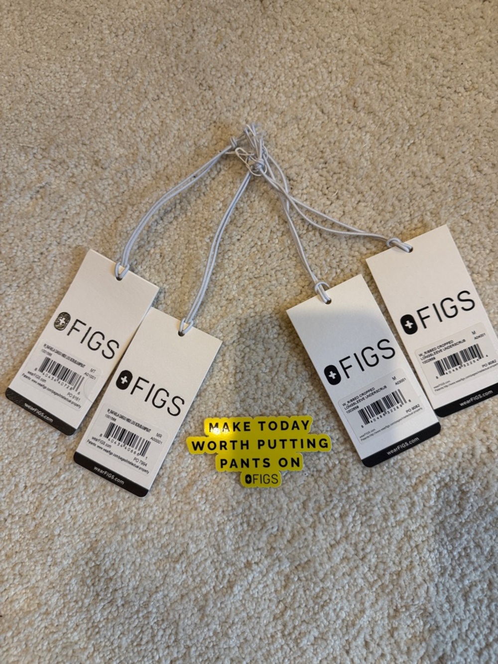 Figs White Hang Tags with Yellow Branded Sticker